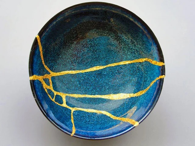 A bowl broken and repaired with gold seams
